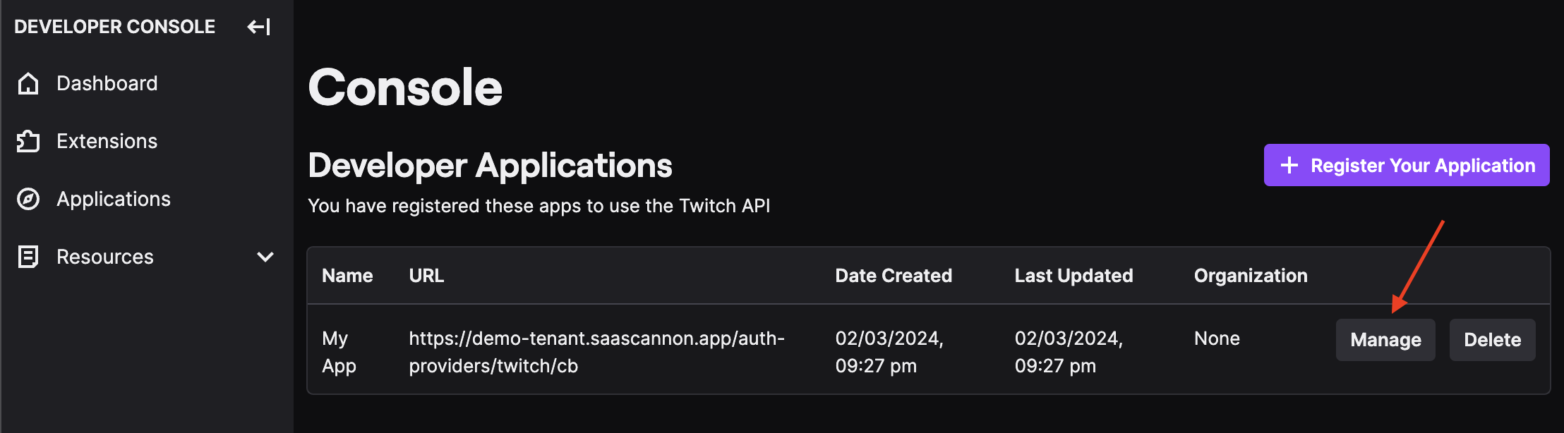 Screenshot of the twicth developer console apps page with an arrow pointing to the manage button for the newly created application